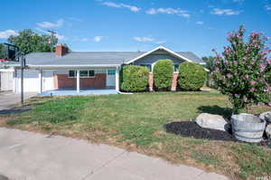 Ranch-style home with a front yard