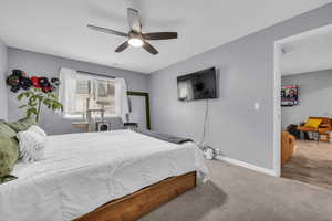 Bedroom with wood-type flooring and ceiling fan