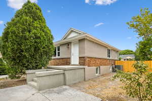 View of side of home in the backyard