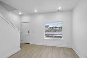 Empty room with light wood-type flooring