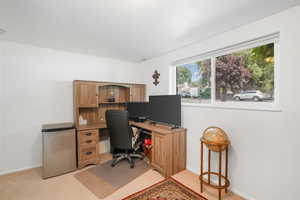 View of carpeted home office or bedroom