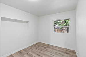 Spare room featuring light hardwood / wood-style floors