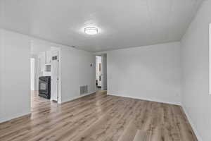 Unfurnished room with light hardwood / wood-style flooring