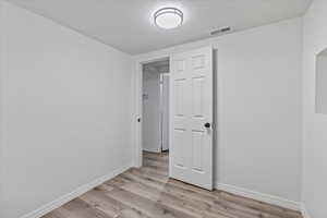 Spare room featuring light hardwood / wood-style flooring