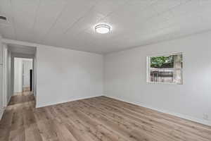 Empty room featuring light hardwood / wood-style floors