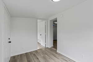 Unfurnished room featuring light wood-type flooring