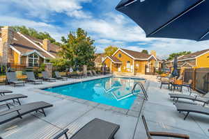 View of swimming pool with a patio