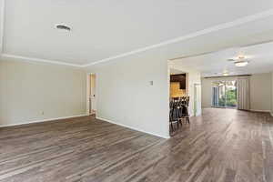 Empty room featuring wood-type flooring