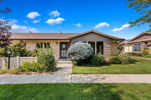 View of front of property with a front yard