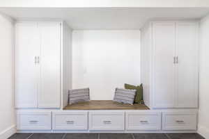 Mudroom featuring dark tile patterned flooring