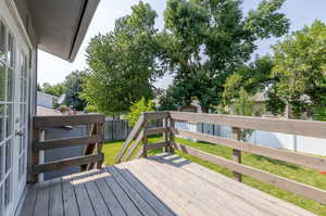 Wooden terrace with a lawn