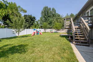 View of yard featuring a playground