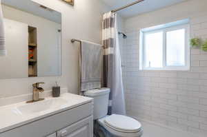 Bathroom with toilet and vanity