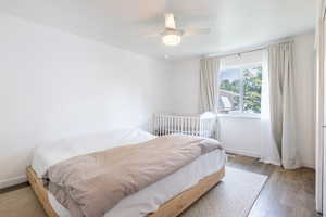 Bedroom featuring light hardwood / wood-style flooring and ceiling fan