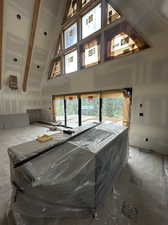 Interior space featuring pool table and a towering ceiling