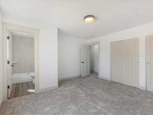 View of primary bedroom with ensuite bathroom