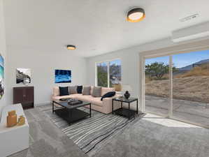 Living room featuring carpet floors and exit to backyard *This photo has been VIRTUALLY staged to show furniture placement potential*