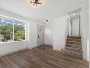 Entrance foyer featuring wood-style floors