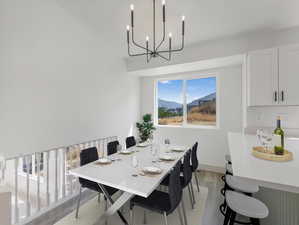 Dining area featuring wood-style flooring *This photo has been VIRTUALLY staged to show furniture placement potential*