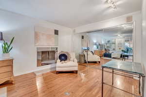 Primary bedroom siting area featuring  wood burning fireplace