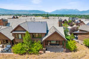 View of front facade featuring a mountain view and a patio