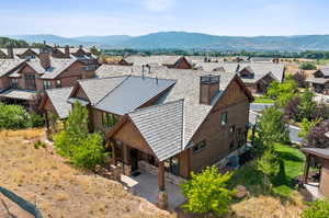 Birds eye view of property with a mountain view