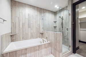 Bathroom with plus walk in shower and tile patterned floors