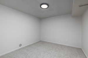 Unfurnished room with carpet flooring