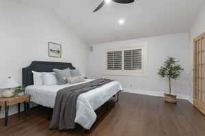 Bedroom featuring lofted ceiling, ceiling fan, and hardwood / wood-style floors