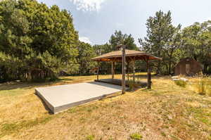 View of yard with a gazebo and a shed