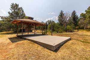 Exterior space featuring a gazebo and a lawn