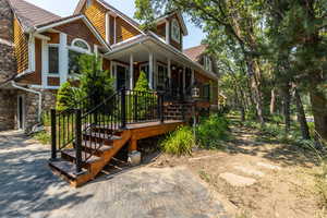 View of side of home featuring a porch