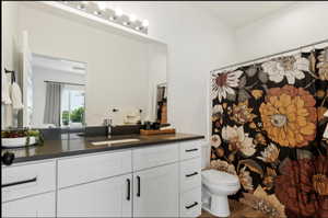 Bathroom featuring toilet and vanity