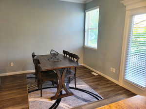 Dining space with crown molding and a wealth of natural light