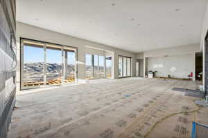 Unfurnished living room with a mountain view