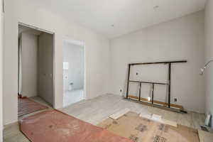 Unfurnished room with light wood-type flooring