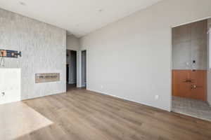 Unfurnished living room with hardwood / wood-style flooring