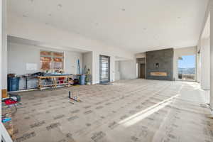 Living room featuring a tiled fireplace