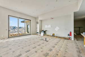 Unfurnished living room featuring a mountain view