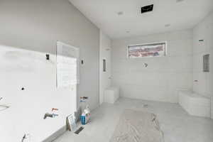 Bathroom with tile patterned floors