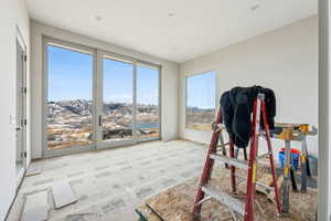 Sunroom featuring a mountain view