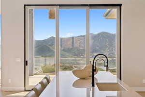 Dining room with plenty of natural light and a mountain view