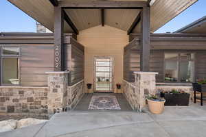 View of exterior entry with stone siding