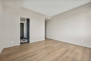 Unfurnished room with light hardwood / wood-style flooring