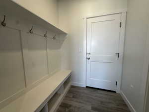 Mudroom with dark hardwood / wood-style floors