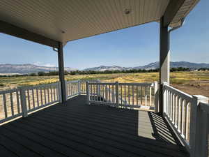 Wooden deck featuring a mountain view