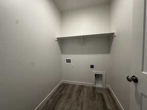 Washroom featuring hookup for an electric dryer, dark hardwood / wood-style flooring, and hookup for a washing machine