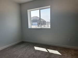 Empty room featuring carpet floors