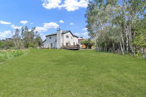 View of yard featuring a wooden deck