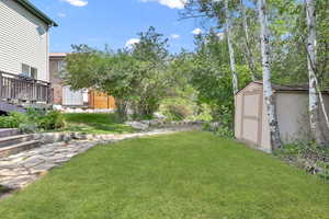 View of yard with a shed